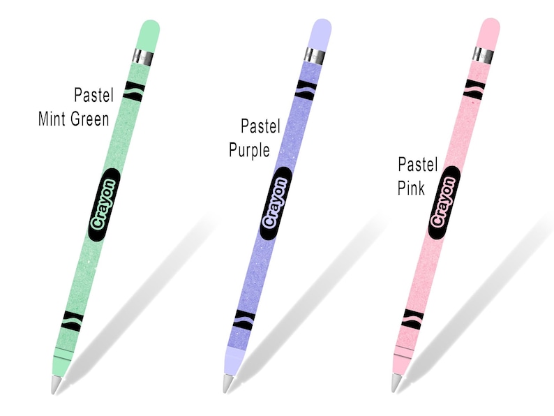 May include: Three Apple Pencil skins with a Crayola crayon design. The skins are pastel mint green, pastel purple, and pastel pink. Each skin has the word "Crayon" printed on it.