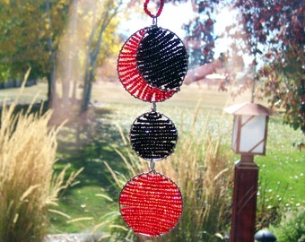 Eclipsed Moon with Circles in Red and Black Beaded Hanging Window Ornament Eclipsed Moon with Circles in Red and Black Beaded Hanging Window Ornament