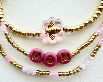 Conjunto de pulseras para mamá en oro y rosa