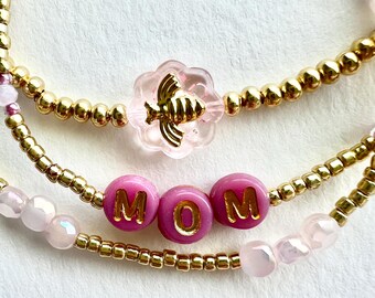 Conjunto de pulseras para mamá en oro y rosa