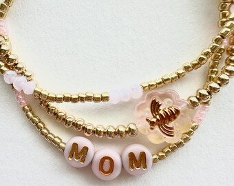 Conjunto de pulseras para mamá en oro y rosa