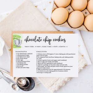 May include: A printable recipe card for chocolate chip cookies with a watercolor illustration of a kitchen mixer. The recipe includes ingredients and directions for baking the cookies.