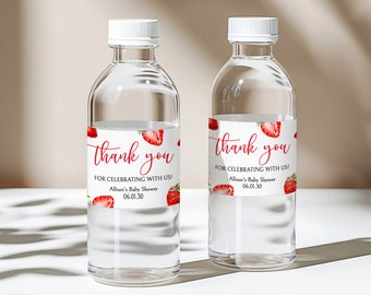 May include: Two clear glass water bottles with white labels featuring red strawberries and the text "thank you for celebrating with us! Allison's Baby Shower 06.01.30"