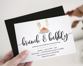 May include: A white invitation card with black calligraphy text that reads "brunch & bubbly". The invitation is for a bridal shower brunch honouring Elizabeth Foster. The event will be held on Saturday, 1st June 2020 at 3pm at Union Station, 1701 Wynkoop Street Denver, CO 80202. RSVP to Emily by 1st May at 303.765.4321. The invitation also states that the couple are registered at Nordstroms.