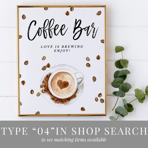 May include: A printable sign for a coffee bar with the text "Coffee Bar" and "Love is brewing, enjoy!" in black text. The sign features a watercolour illustration of a cup of coffee with a heart design in the foam.