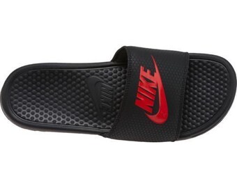 red nike slides with gold check