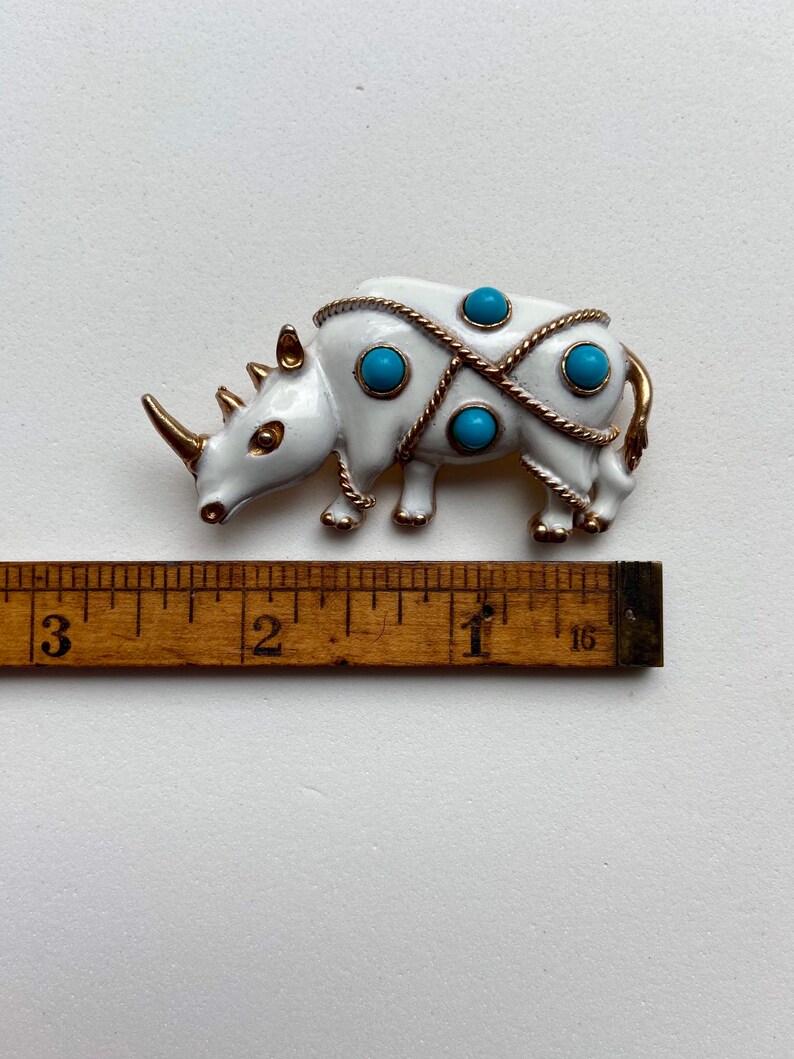 Vintage JJ white rhinoceros brooch with faux turquoise beads
