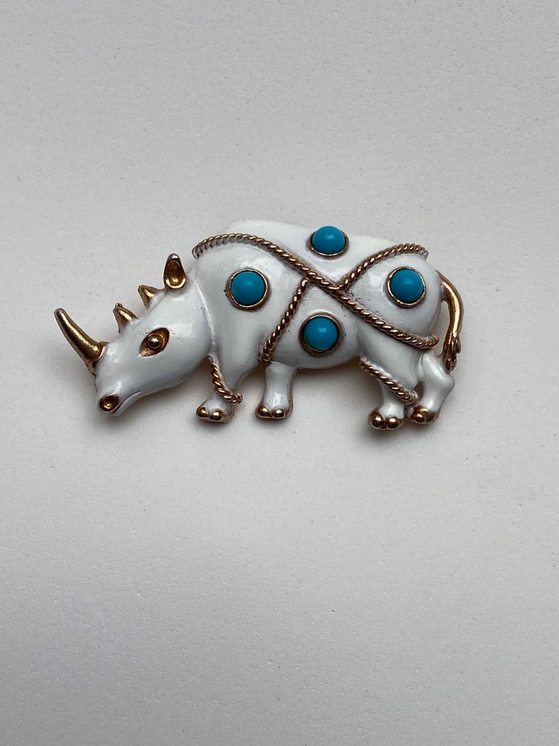 Vintage JJ white rhinoceros brooch with faux turquoise beads