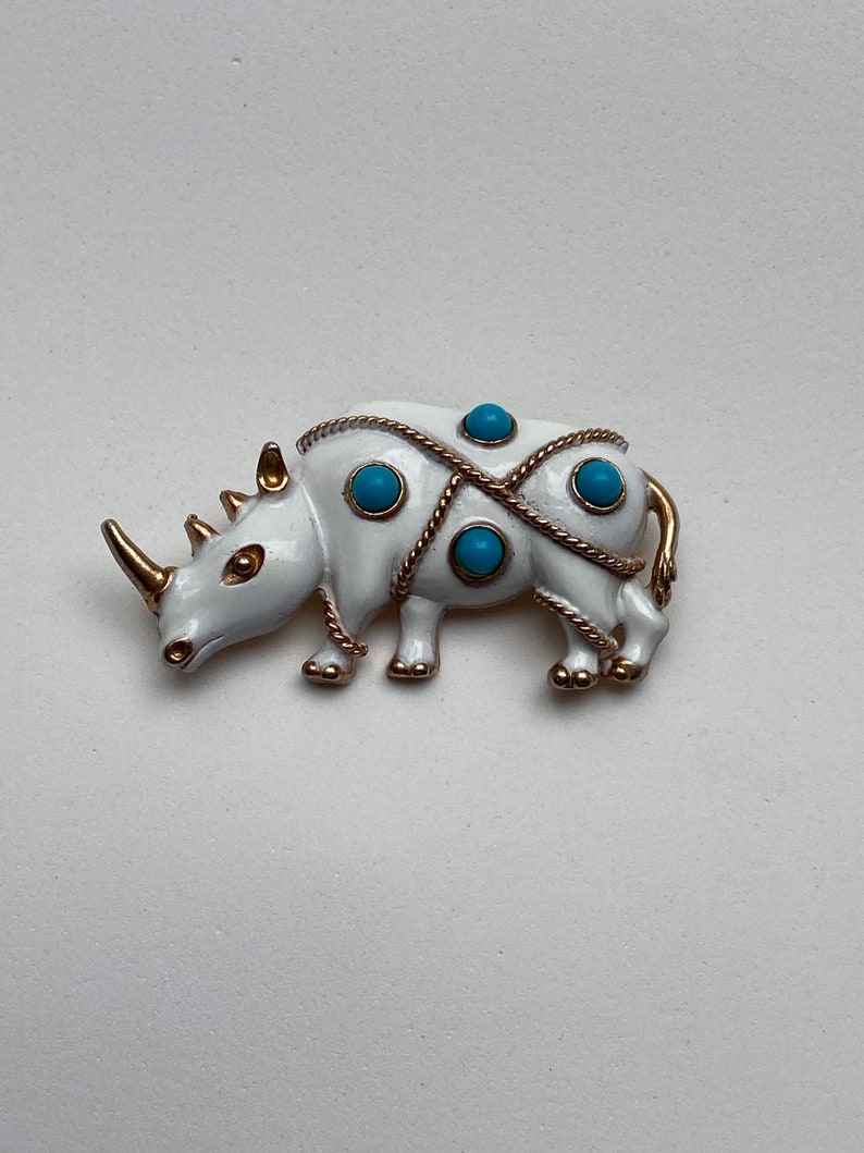 Vintage JJ white rhinoceros brooch with faux turquoise beads
