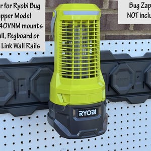 May include: A black wall mount holder for a Ryobi Bug Zapper Model P29140VNM. The holder is mounted on a pegboard and can also be mounted to a wall or Ryobi Link Wall Rails. The text "Bug Zapper NOT included" is visible in the image. The Ryobi Bug Zapper is not included.