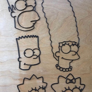 3D printed PLA plastic Simpsons family cartoon shapes. 3/8” thick Homer, Bart, Marge, Lisa, and Maggie.
