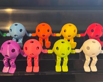 Articulated Pickleball figure with paddle hands and feet. Bends at the knee. Many colors available. Tennis, racquet sports gift