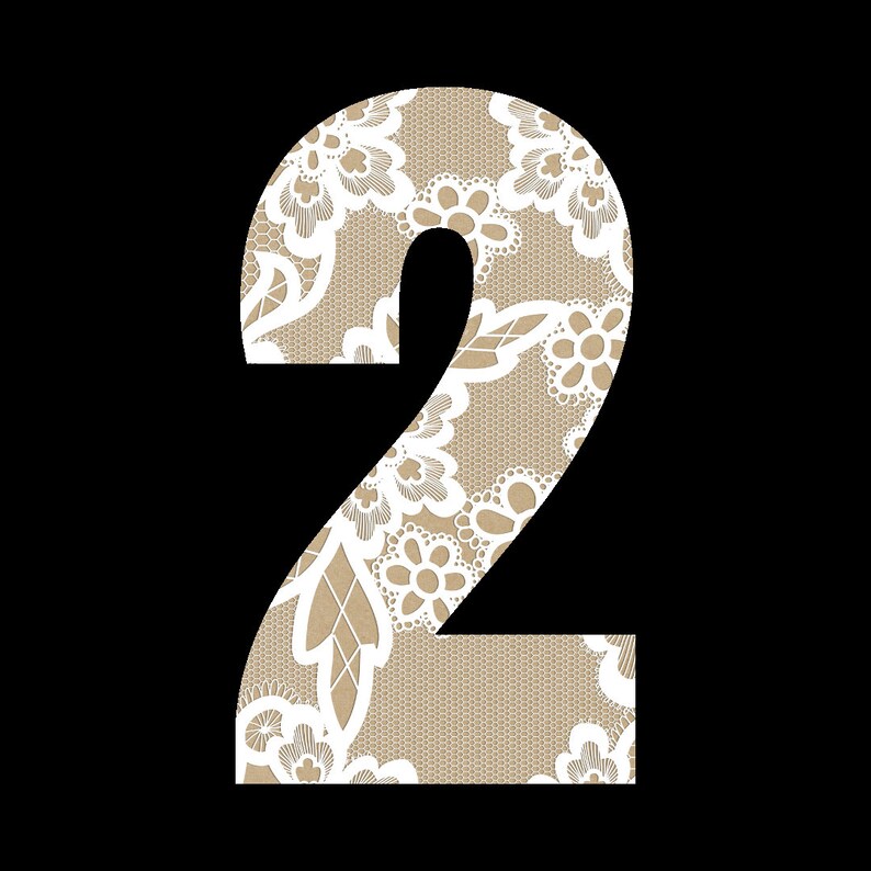 May include: A white number two with a lace pattern in beige and white.