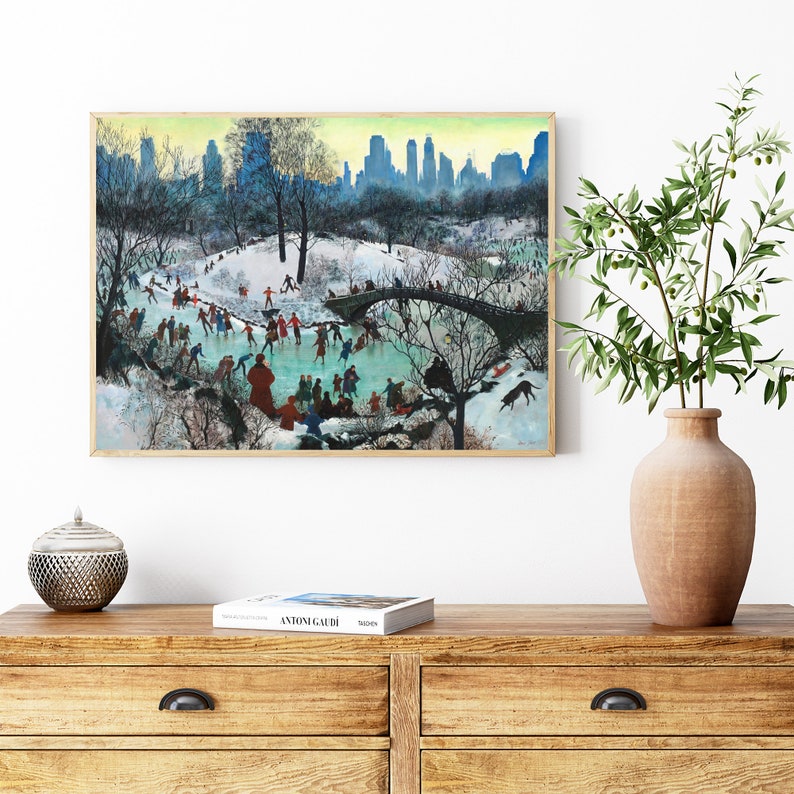 May include: A vintage painting depicting a winter scene in Central Park, New York City. People are ice skating on a frozen pond, with a bridge in the background. The cityscape is visible in the distance.