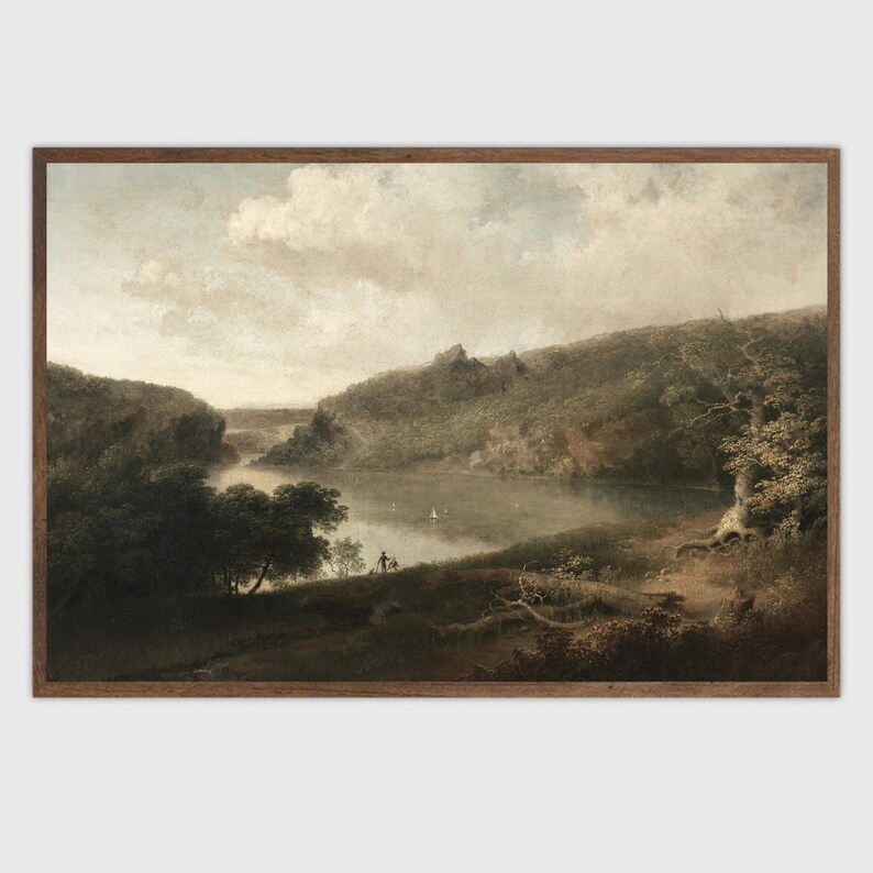 May include: A framed landscape painting depicts a serene lake scene. The artwork features a calm body of water surrounded by lush green hills and trees under a cloudy sky. A small sailboat and figures are visible on the lake and shore.