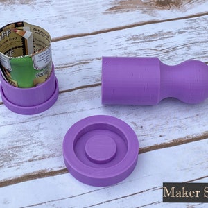 May include: Three purple 3D printed moulds for making resin crafts. The moulds are in the shape of a cylinder, a round base, and a cylinder with a rounded top.