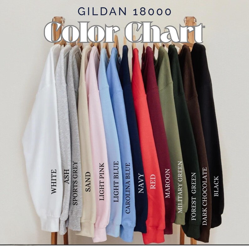 May include: A color chart of Gildan 18000 sweatshirts in various colors, including white, ash, sports grey, sand, light pink, light blue, carolina blue, navy, red, maroon, military green, forest green, dark chocolate, and black. The text "Color Chart" is at the top.