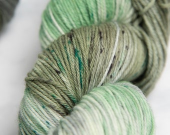 Misty Isle, Sock Fingering Weight Yarn - Muted greens and greys variegated speckled Hand dyed 100% Superwash Merino