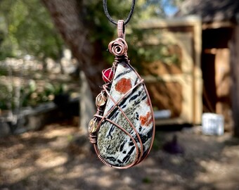 Hornblende with Garnet and Channel Set Synthetic Ruby and White Topaz Wrapped in Copper Pendant