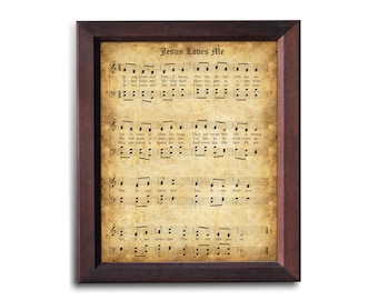 May include: A framed print of a vintage sheet music for the hymn "Jesus Loves Me". The sheet music is printed on aged paper with a brown background and features the lyrics and musical notation for the song.