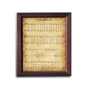 May include: A vintage-style framed print of a hymn sheet music score for the song "I Surrender All". The sheet music is printed on aged paper with a brown background and features musical notes and lyrics.