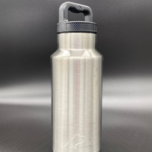 May include: A silver stainless steel water bottle with a black handle and a mountain logo. The bottle has a brushed finish.