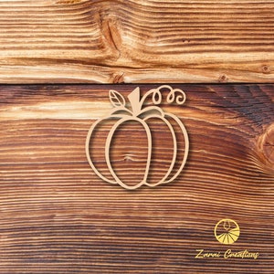 May include: A simple line drawing of a pumpkin with a stem and leaves on a wood background. The image is in a light brown color.