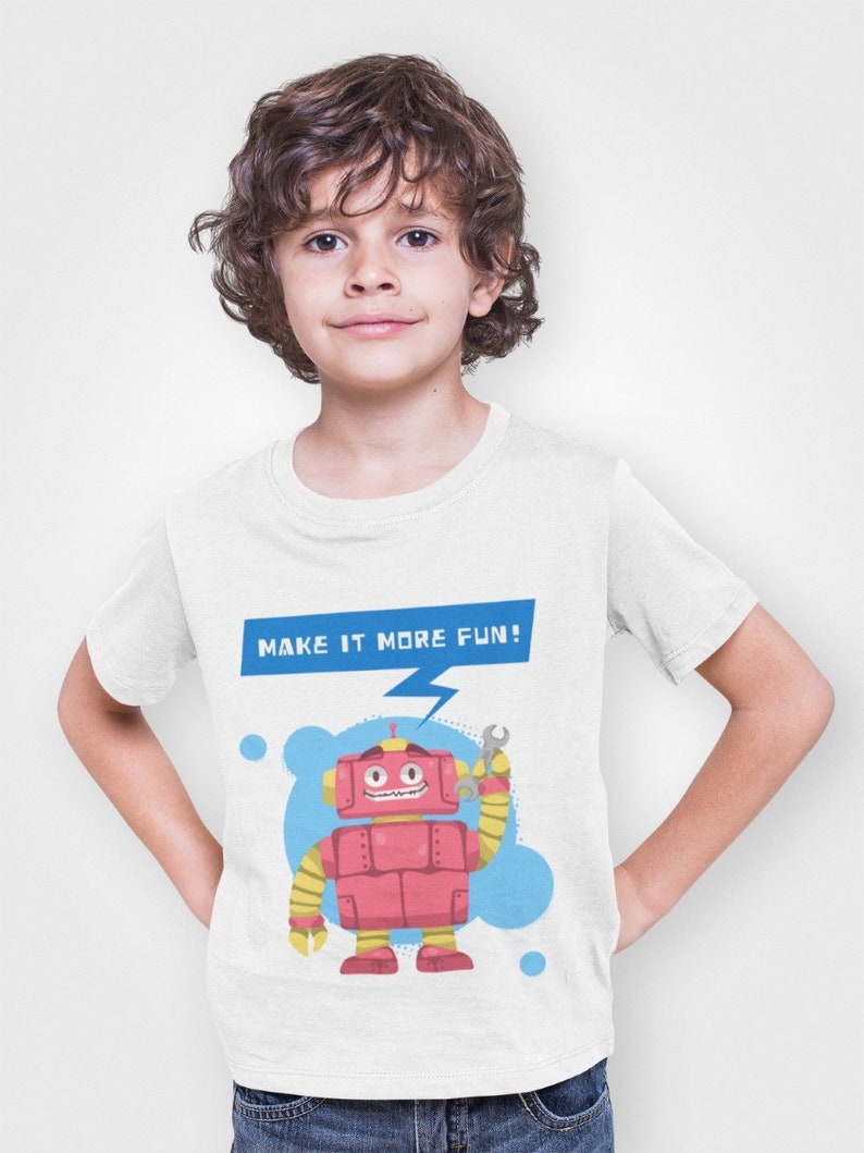 May include: White t-shirt with a cartoon robot holding a wrench. The robot is red with yellow arms and legs. The text "MAKE IT MORE FUN!" is above the robot.