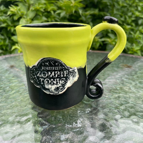 Green and black zombie tonic mug. Halloween wheel thrown hand painted underglaze transfers ceraminc stoneware made in USA