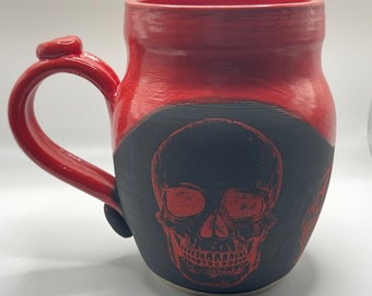 Red skull heart brain decals on black with a wavy red glaze on top half and inside  wheel thrown hand painted stoneware USA  coffee mug #173