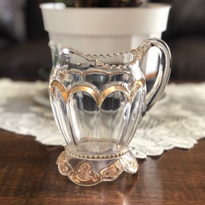 Vintage clear glass creamer with gold trim #494