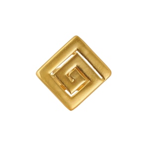 May include: A gold-colored, square-shaped ring with a geometric spiral design. The ring has a matte finish and is set against a white background. The design is a continuous, maze-like pattern within the square.