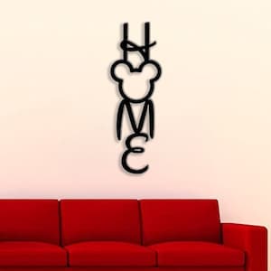 May include: Black metal wall decor with the word "HOME" spelled out in a stylized font. The letter "O" is replaced with a cartoon bear head.
