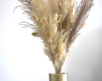 Bouquet floral composition of beige dried flowers Chinese reeds pampas lagurus