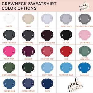 May include: A color chart displays various crewneck sweatshirt color options. Colors include white, sand, ash, sport grey, graphite heather, dark heather, charcoal, dark chocolate, black, light pink, neon pink, maroon, heather red, red, heather dark green, military green, forest, light blue, carolina blue, indigo blue, heather navy, navy, and sapphire.