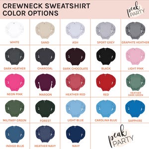 May include: A color chart displays various crewneck sweatshirt color options. Colors include white, sand, ash, sport grey, graphite heather, dark heather, charcoal, dark chocolate, black, light pink, neon pink, maroon, heather red, red, heather dark green, military green, forest, light blue, carolina blue, indigo blue, heather navy, navy, and sapphire.