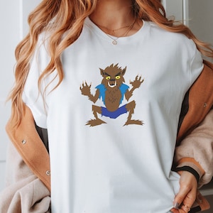 Classic Werewolf Cartoon Graphic T-Shirt - Unique Retro Halloween Wolf Man - Perfect Gift for Monster Fans | Unisex t-shirt
