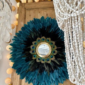 JUJUHAT “GEORGIOS” in blue and black feathers and its gilded brass mirror