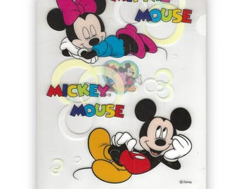 May include: A white folder with a Mickey Mouse and Minnie Mouse design. The folder has a colorful Mickey Mouse and Minnie Mouse design with the words "Mickey Mouse" and "Minnie Mouse" in a colorful font. The folder also has the word "IRUIIMOY" printed on the bottom.
