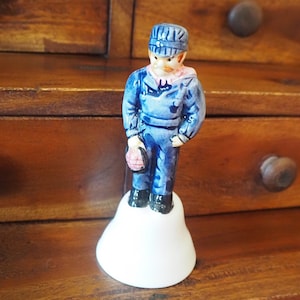 Vintage Train Engineer Figurine Bell: Collectible Kitsch Decor