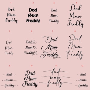 May include: Twelve different variations of the words "Dad", "Mum", and "Freddy" in black text on a pink background. The words are arranged in a grid of four columns and three rows.