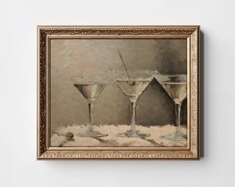 May include: A framed painting of three martini glasses with olives, set on a white tablecloth. The painting is done in a muted palette of browns and grays.