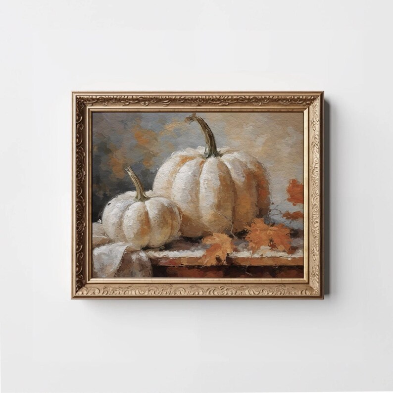 Pode incluir: Uma pintura emoldurada de duas ab&oacute;boras brancas com folhas de outono sobre uma mesa de madeira. As ab&oacute;boras s&atilde;o pintadas em um estilo realista com pinceladas sutis.