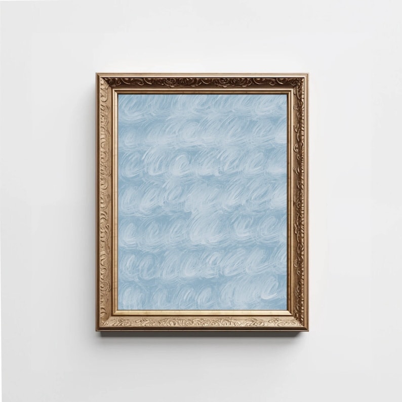 May include: A framed painting with a blue and white abstract design. The frame is gold and has a decorative pattern.