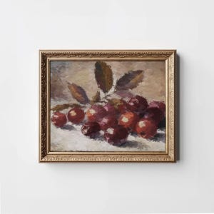 Peut inclure: Une peinture encadrée d'une nature morte avec un groupe de raisins rouges et violets dans un cadre doré.