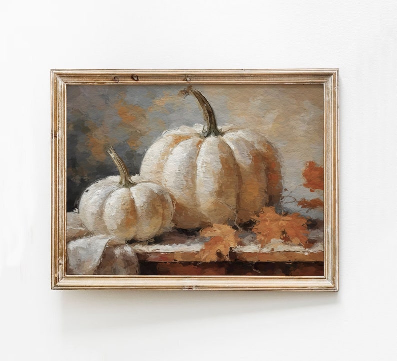 Pode incluir: Uma pintura de duas ab&oacute;boras brancas com caules marrons, sentadas em uma mesa com folhas marrons e laranja. O fundo &eacute; azul claro e cinza.