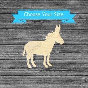 May include: A wooden donkey cutout in a light tan color, standing on four legs. The image includes a blue banner with the text "Choose Your Size". The donkey is a silhouette, perfect for crafts.