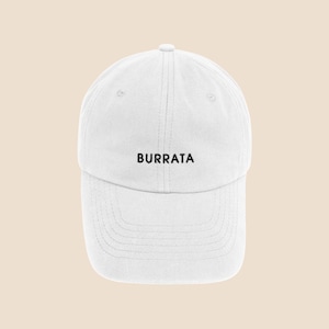May include: White baseball cap with the word "BURRATA" embroidered in black on the front.