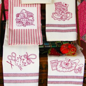 May include: Four white kitchen towels featuring red embroidered sewing motifs. Designs include a basket with snaps, a container labeled buttons and needles, a pincushion with scissors, and a needle pack with a floral hoop. Some towels have red stripes.