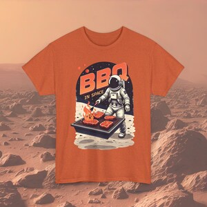 BBQ in Space Astronaut T-Shirt - Fun Grill-Inspired Tee for BBQ Lovers & Sci-Fi Enthusiasts | Unique Unisex Cotton Shirt